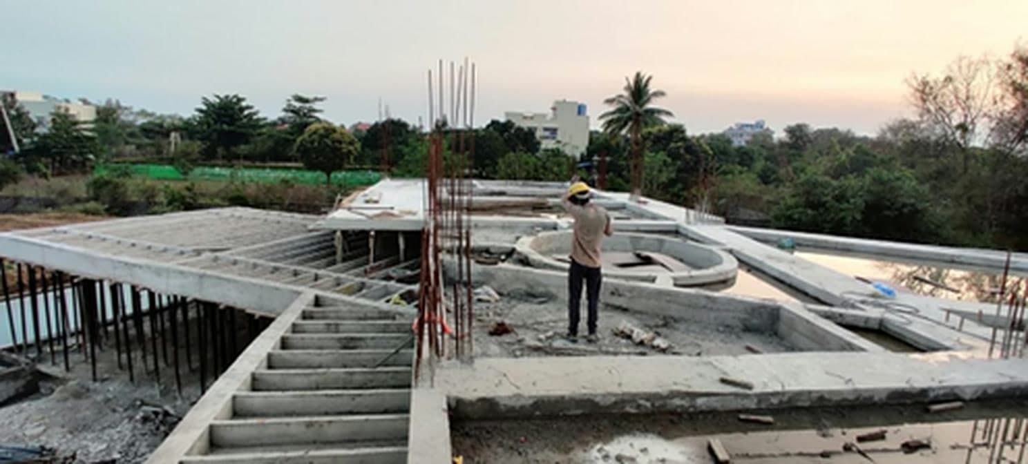 Foundation and slab work in progress for the Gandipet lake-view luxury villa