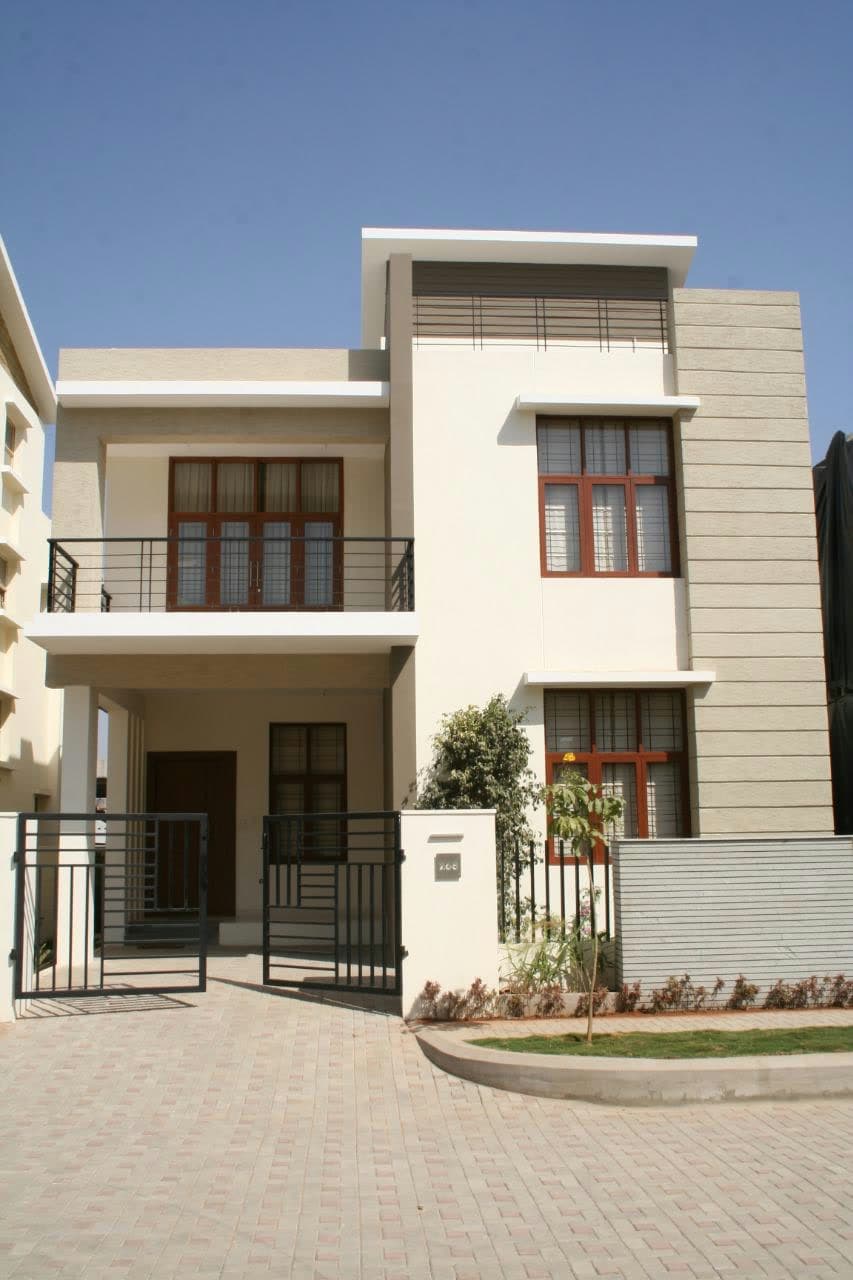Indus Villas — completed two-storey independent residential villa with a private driveway and gate