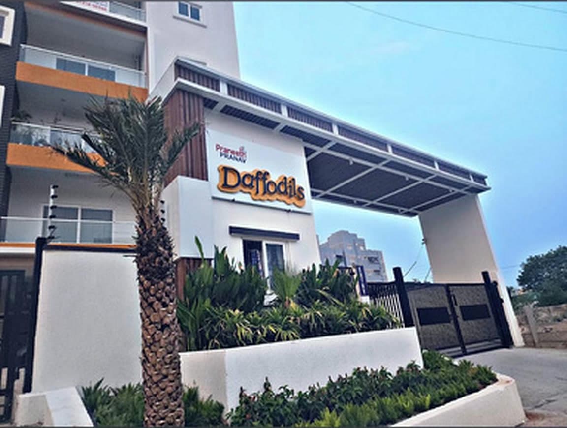 Completed Praneeth Pranav Daffodils apartment entrance with signage and landscaping